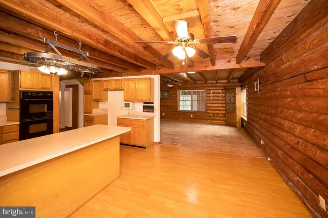 a kitchen with granite countertop stainless steel appliances and wooden cabinets