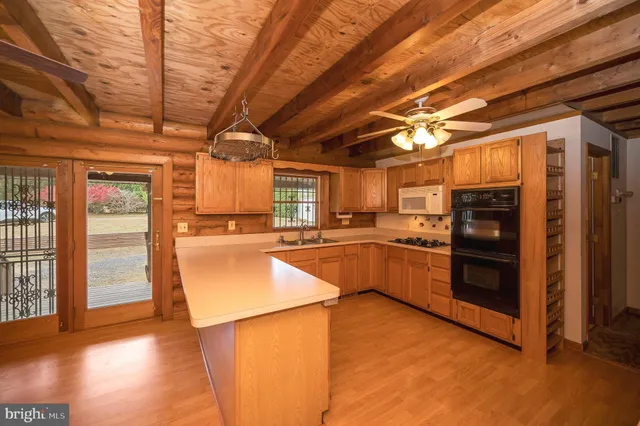 a kitchen with a window a sink and a counter top space