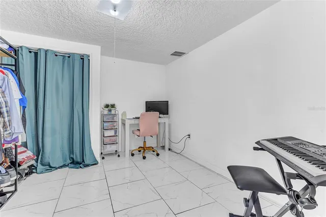 a room with furniture a rug and a closet