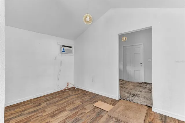 a view of hallway with wooden floor