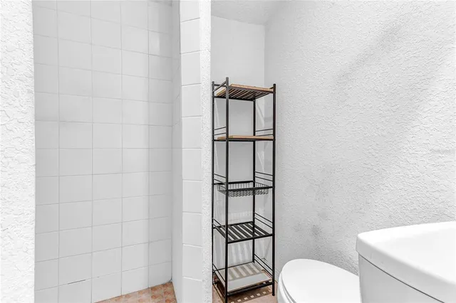 a bathroom with a toilet and a sink