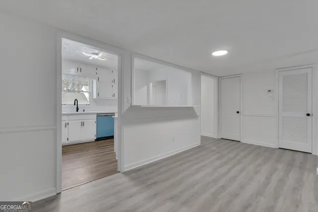 a view of a kitchen cabinets and wooden floor