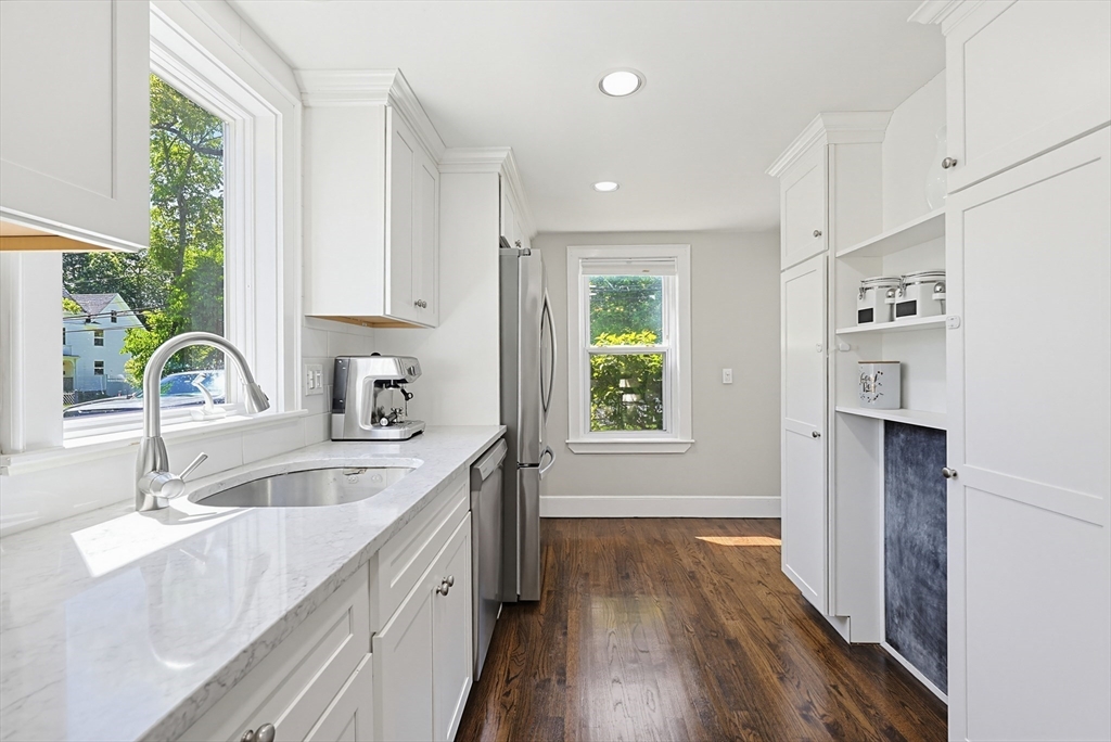 345 Sherman Street Canton, MA 02021 - Photo 10 of 42 a kitchen with a sink a refrigerator and window