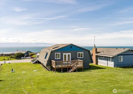 an aerial view of a house with a big yard