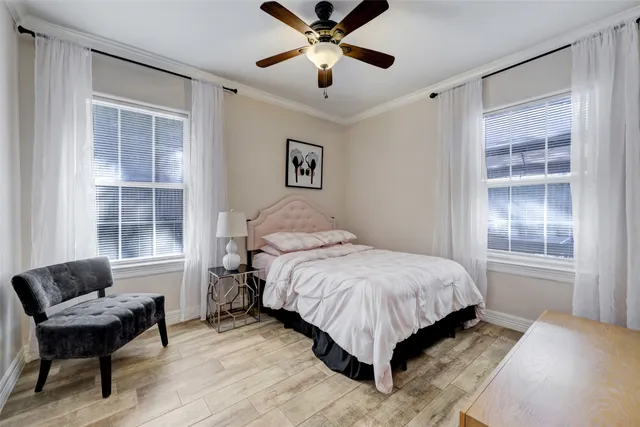 a bedroom with a bed and a couch