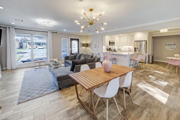 a living room with fireplace furniture and a wooden floor