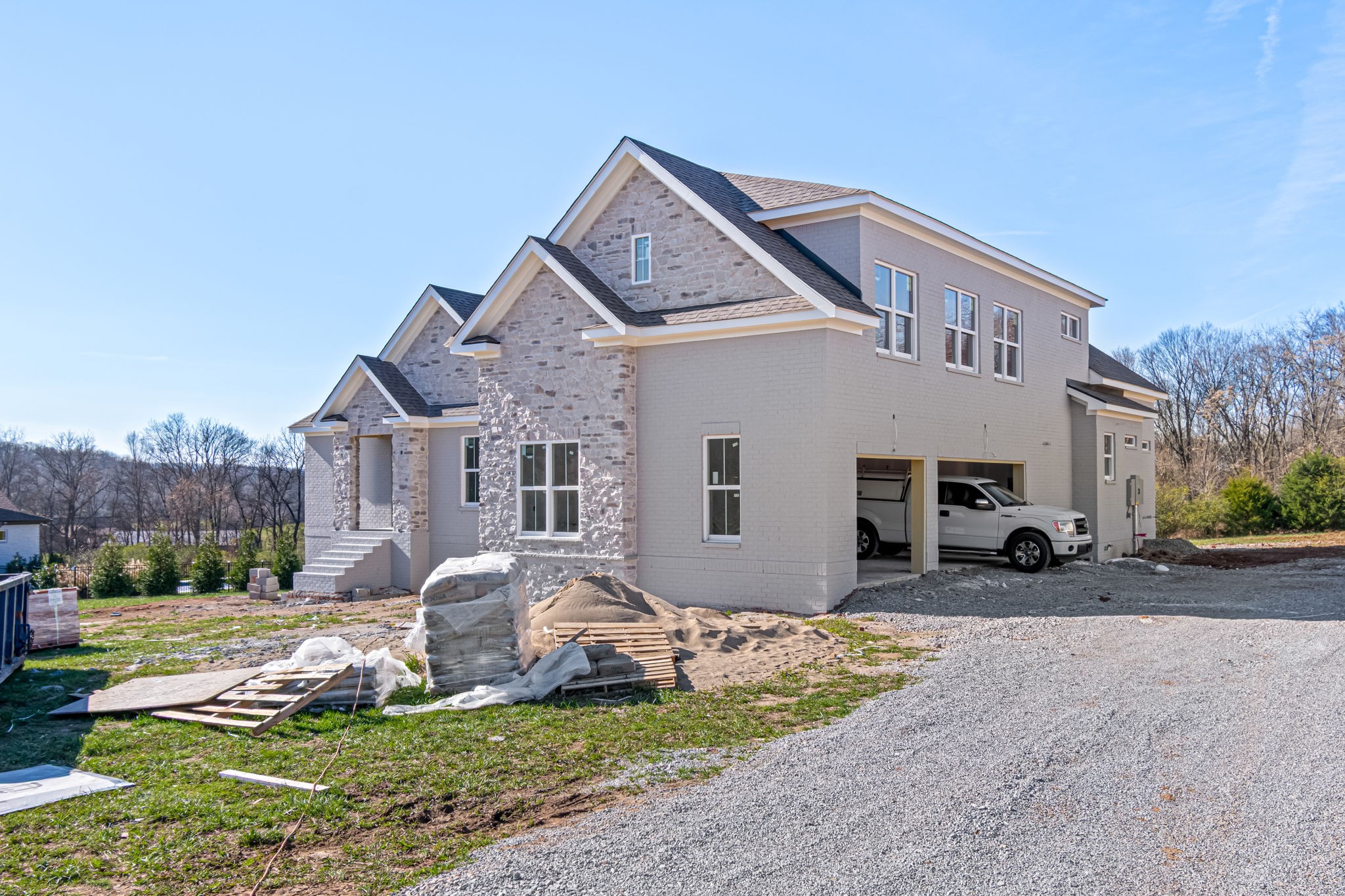 4037 Advocate Path Culleoka, TN 38451 - Photo 3 of 5 a front view of a house with a yard and garage