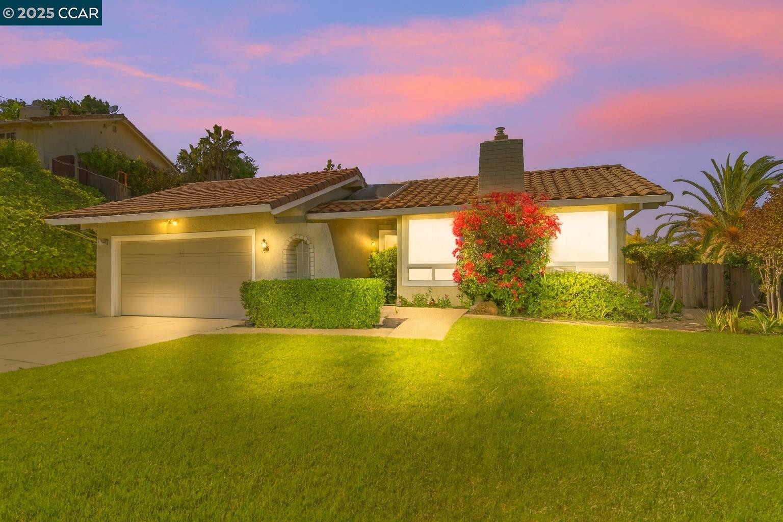 a front view of a house with a yard