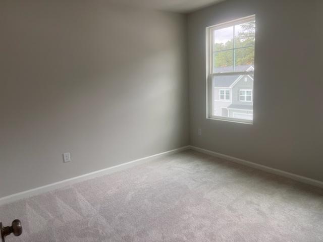 217 Ivy Vine Way Raleigh, NC 27610 - Photo 11 of 18 an empty room with a window