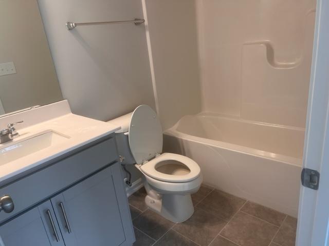 217 Ivy Vine Way Raleigh, NC 27610 - Photo 12 of 18 a bathroom with a sink a toilet and shower