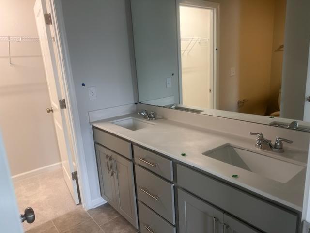217 Ivy Vine Way Raleigh, NC 27610 - Photo 14 of 18 a bathroom with a sink and a mirror