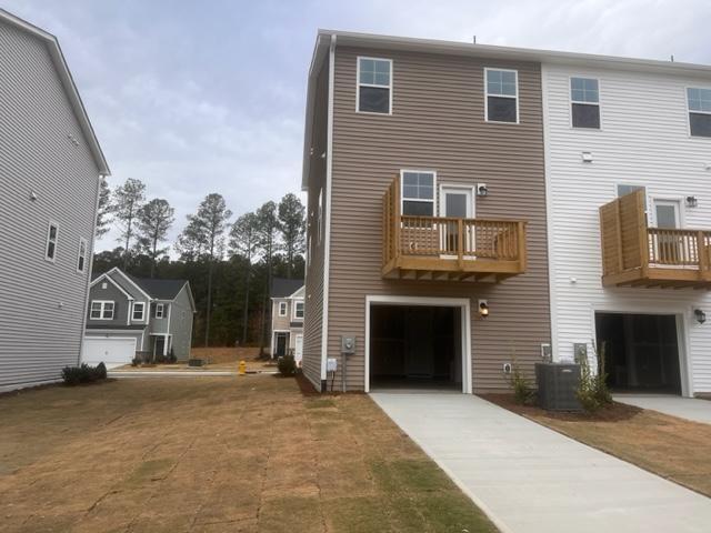 217 Ivy Vine Way Raleigh, NC 27610 - Photo 17 of 18 a front view of a house with a yard and garage