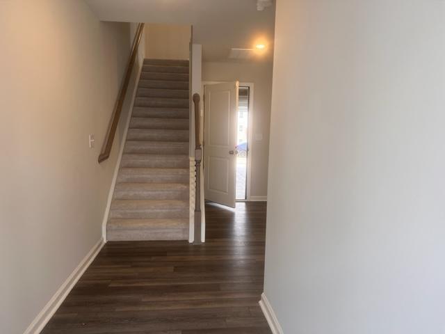 217 Ivy Vine Way Raleigh, NC 27610 - Photo 4 of 18 a view of entryway and hall with wooden floor
