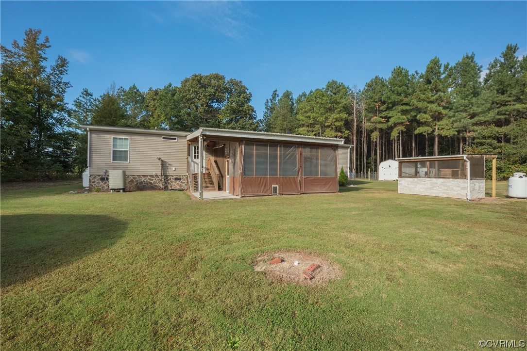 20602 Reese Road Dinwiddie, VA 23841 - Photo 29 of 50 a house view with a backyard space