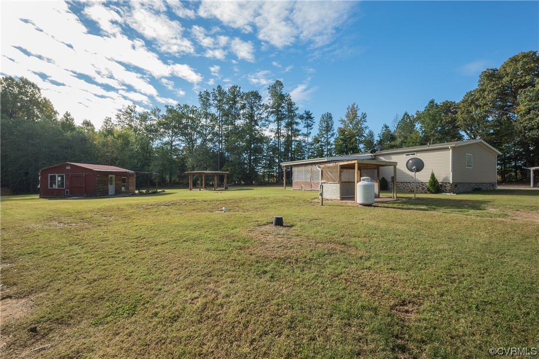20602 Reese Road Dinwiddie, VA 23841 - Photo 30 of 50 a front view of a house with a yard