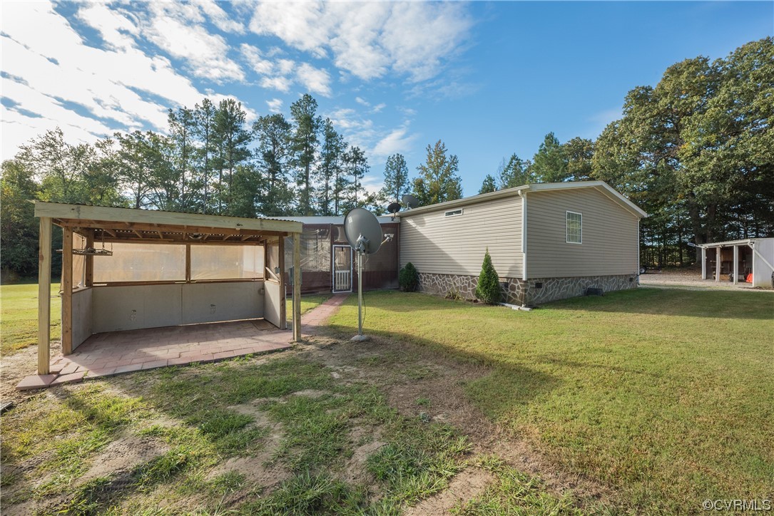 20602 Reese Road Dinwiddie, VA 23841 - Photo 31 of 50 a view of backyard with a garden and trees