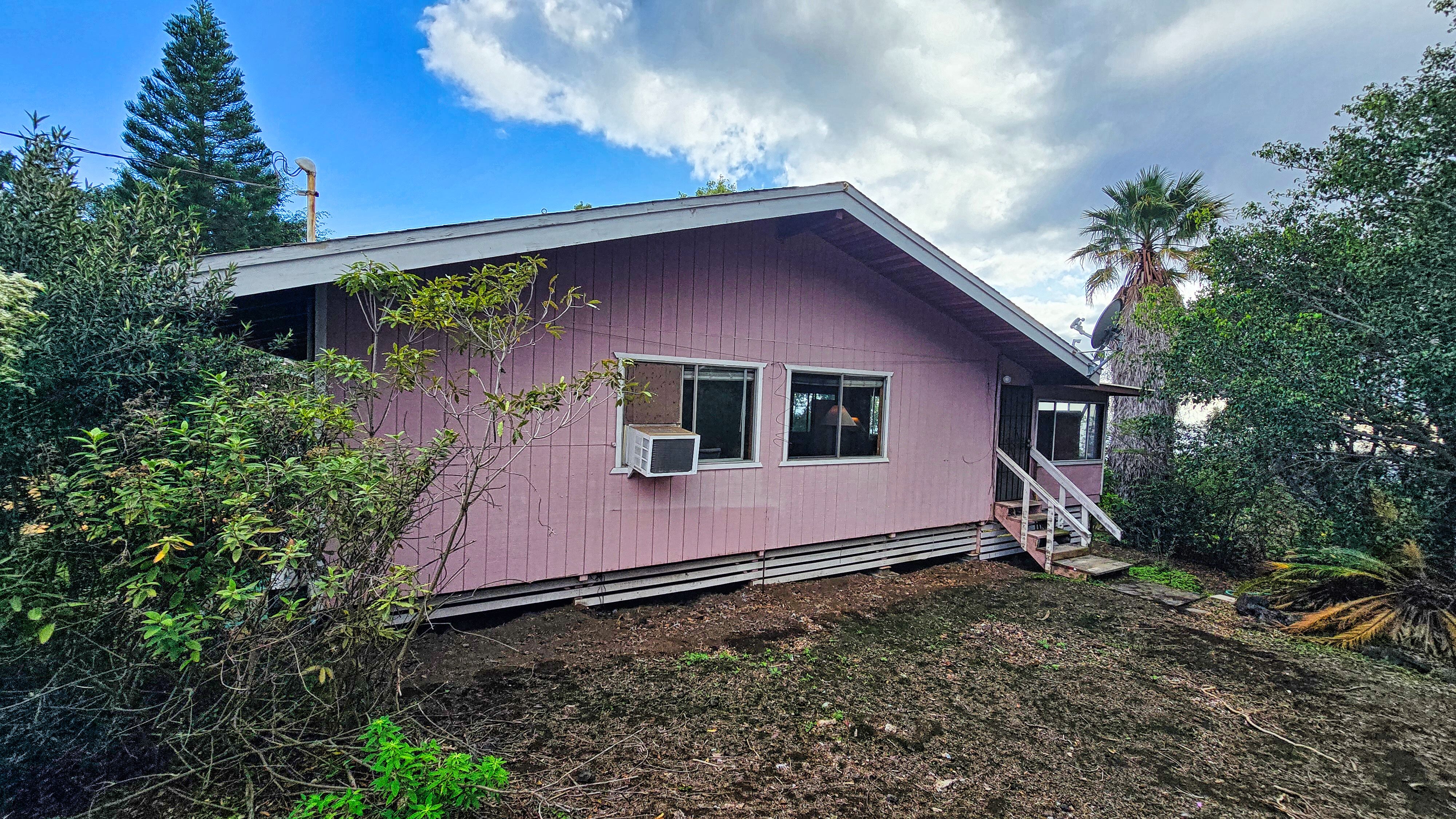 92-8233 Reef Parkway Ocean View, HI 96704 - Photo 27 of 30 a house with trees in front of it