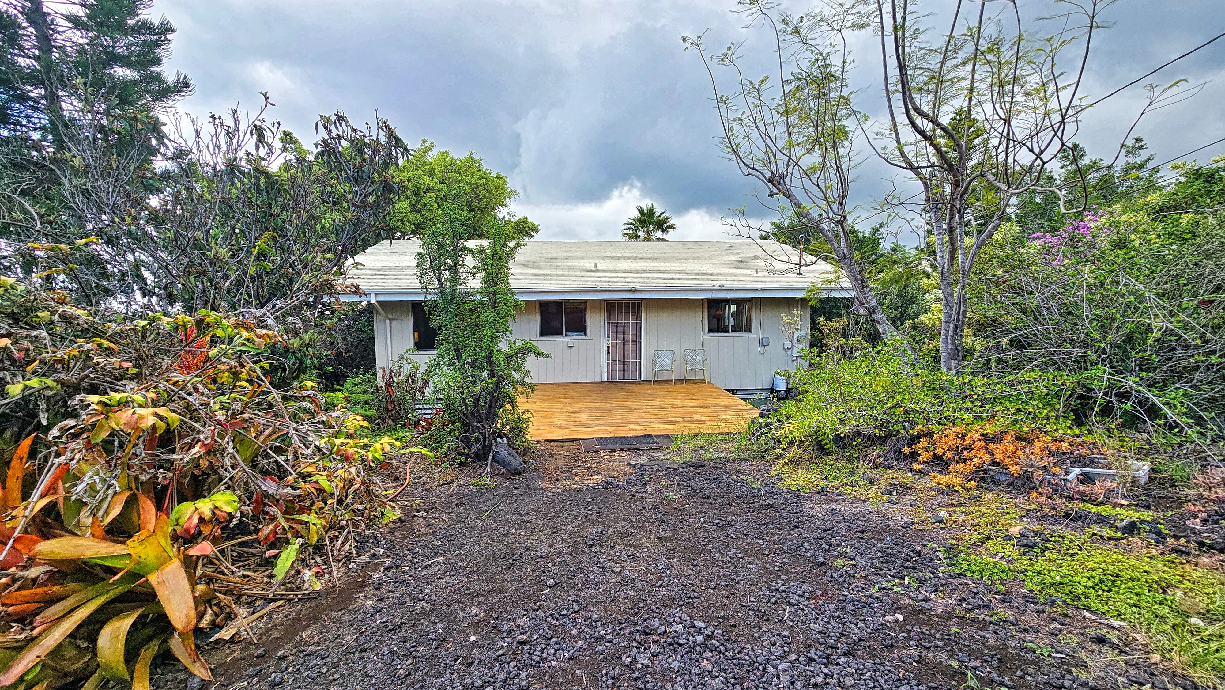 92-8233 Reef Parkway Ocean View, HI 96704 - Photo 5 of 30 a view of a house with a yard and sitting area