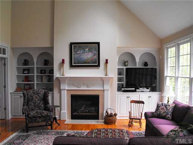 2124 Tibwin Drive Raleigh, NC 27606 - Photo 6 of 6 This large family room has two skylights and a wall of windows that brings the backyard into the home.