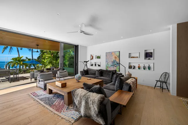 a bedroom with a bed and balcony view