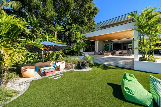 a bathroom with a shower a toilet and a sink