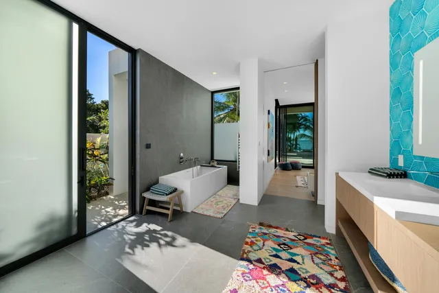 a bedroom with a bed and a view of living room