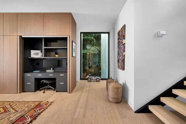 a bathroom with a toilet sink a mirror and a shower