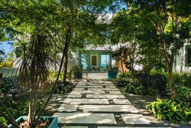 a kitchen with kitchen island a sink appliances and cabinets