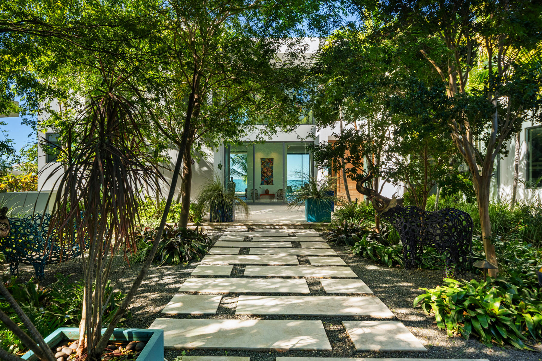 19 Avacado Street Islamorada, FL 33036 - Photo 4 of 104 a front view of a house with a garden