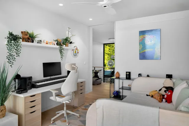 a view of a lake with boats and trees in the background