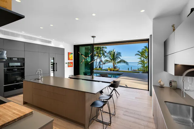 a living room with lots of furniture and a book shelf