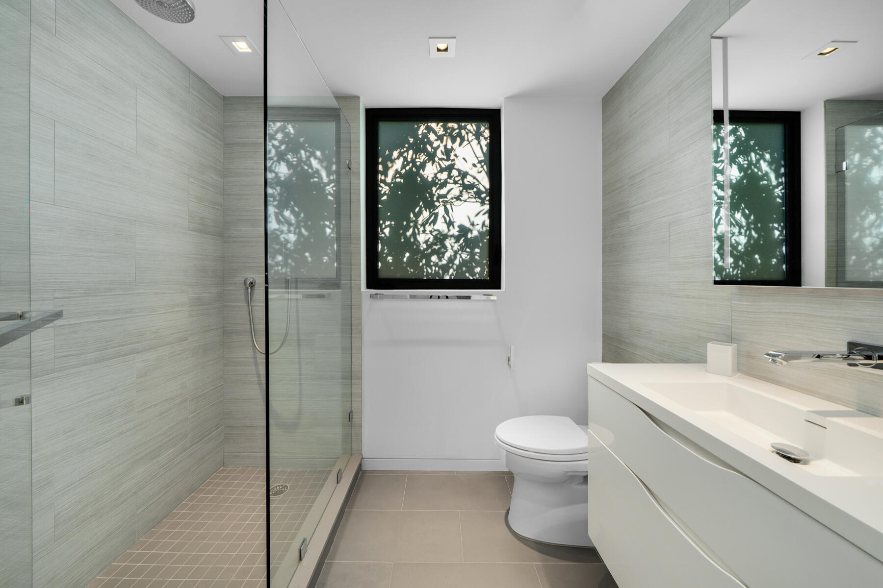 19 Avacado Street Islamorada, FL 33036 - Photo 65 of 104 a bathroom with a toilet sink a mirror and a shower
