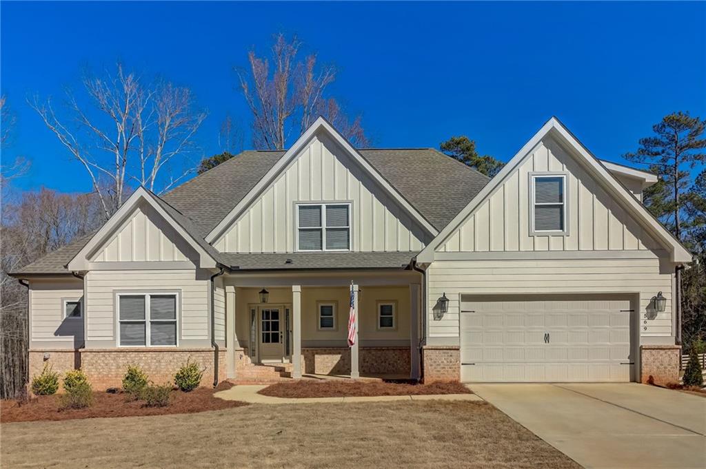 569 White Oak Way Monroe, GA 30655 - Photo 1 of 50 a front view of a house with a yard
