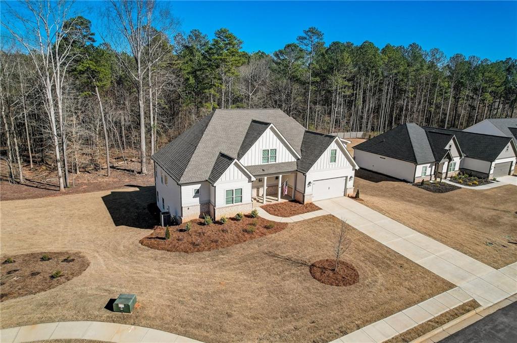 569 White Oak Way Monroe, GA 30655 - Photo 2 of 50 a view of a house with backyard