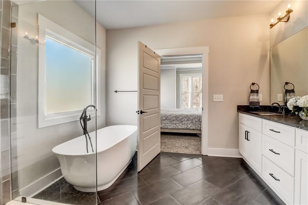 569 White Oak Way Monroe, GA 30655 - Photo 24 of 50 a living room with a couch and a table