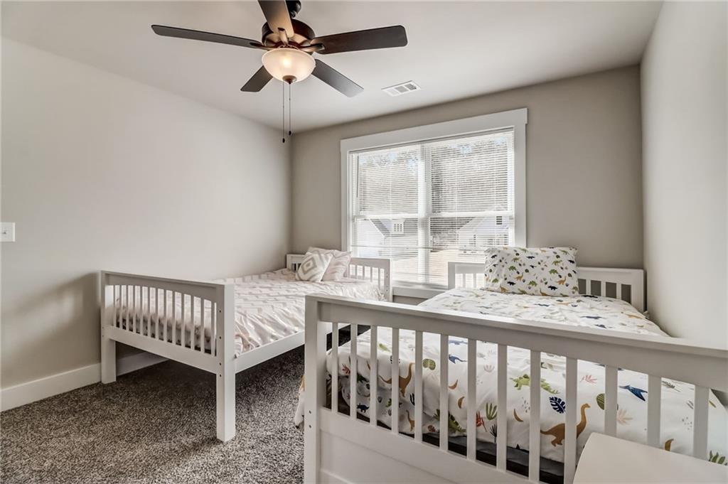 569 White Oak Way Monroe, GA 30655 - Photo 28 of 50 a bedroom with furniture and a window