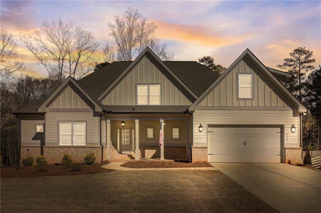 569 White Oak Way Monroe, GA 30655 - Photo 46 of 50 a front view of a house with a yard