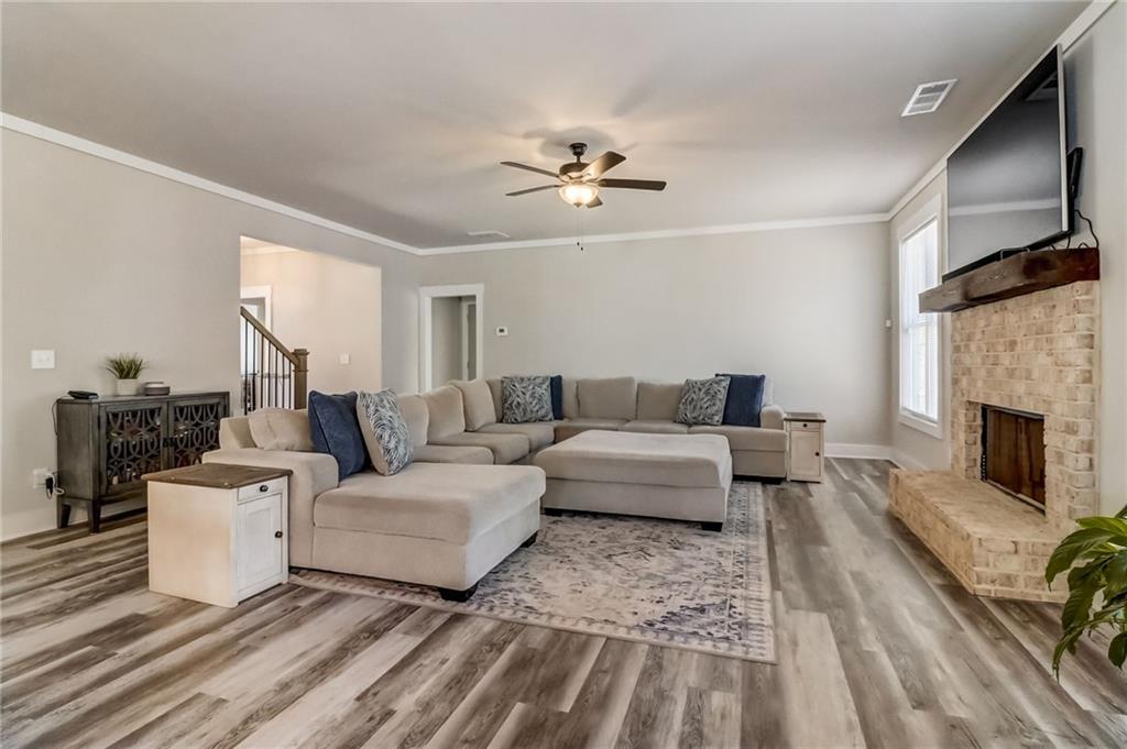 569 White Oak Way Monroe, GA 30655 - Photo 6 of 50 a living room with furniture and a fireplace