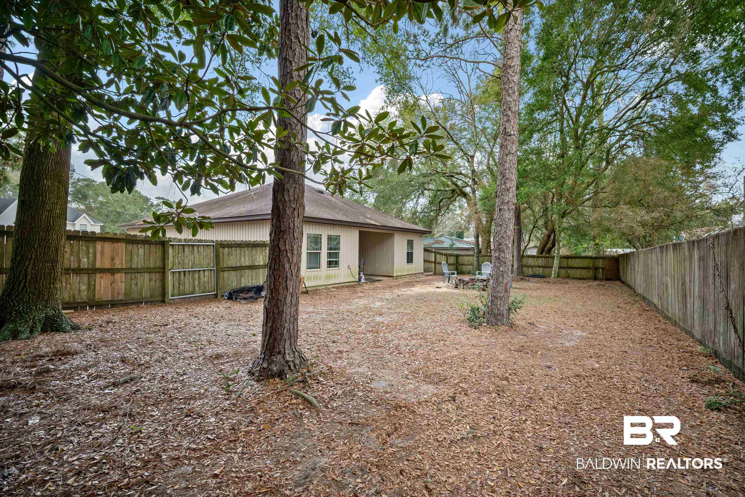 209 Maplewood Loop Daphne, AL 36526 - Photo 22 of 23 Rear view of property with a fenced backyard and a gazebo