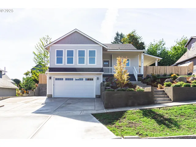 a front view of a house with garden
