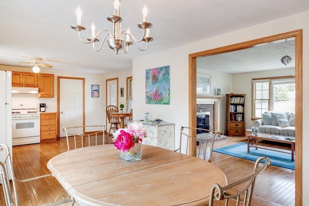 221 Camelback Road Barnstable, MA 02648 - Photo 12 of 31 a view of a dining room with furniture and wooden floor