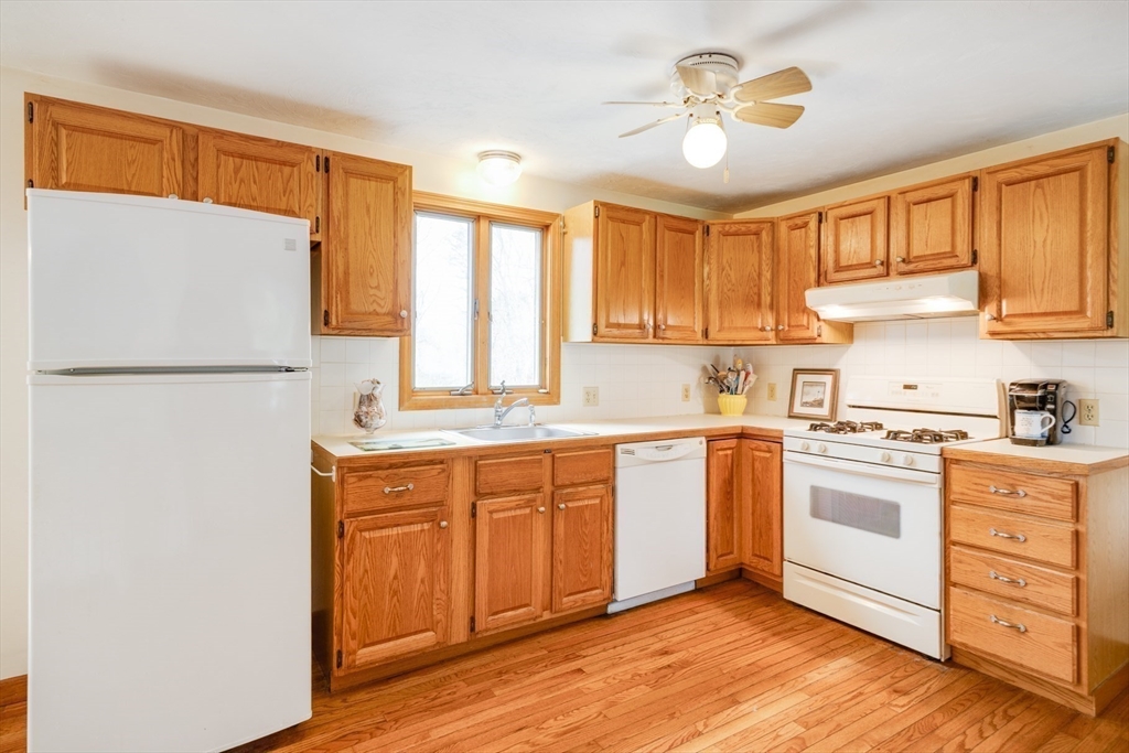 221 Camelback Road Barnstable, MA 02648 - Photo 13 of 31 a kitchen with cabinets stainless steel appliances and a window