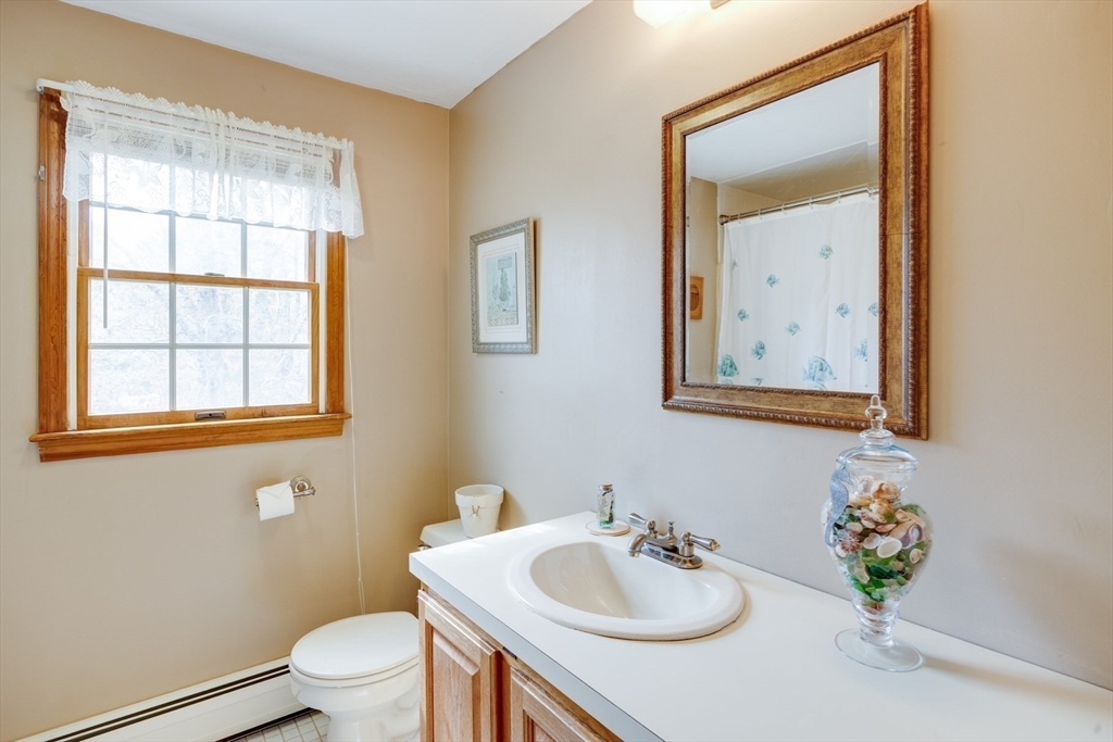 221 Camelback Road Barnstable, MA 02648 - Photo 18 of 31 a bathroom with a sink vanity mirror and toilet