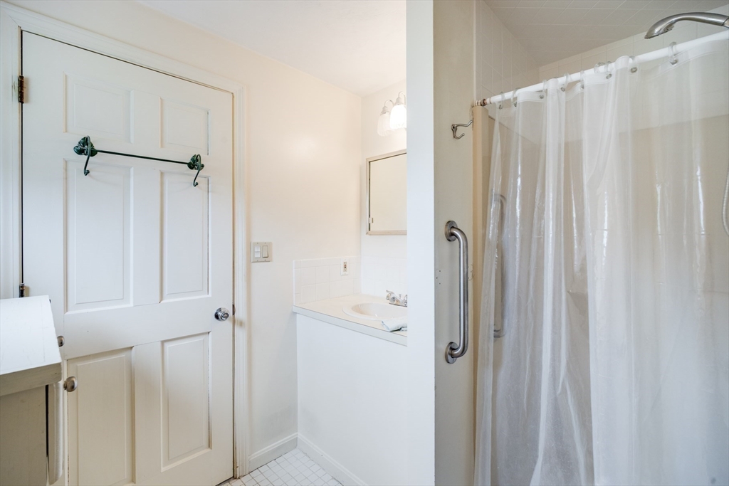 221 Camelback Road Barnstable, MA 02648 - Photo 23 of 31 a bathroom with a shower and a glass door