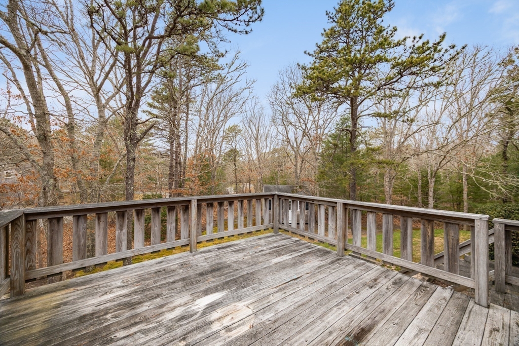 221 Camelback Road Barnstable, MA 02648 - Photo 28 of 31 a balcony with wooden floor and fence