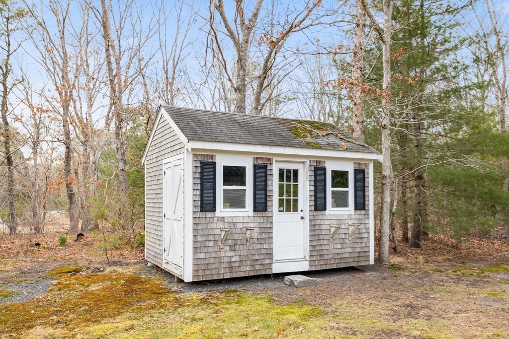 221 Camelback Road Barnstable, MA 02648 - Photo 30 of 31 a view of a house with a yard