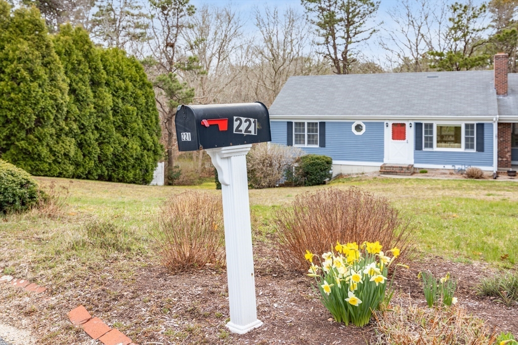 221 Camelback Road Barnstable, MA 02648 - Photo 3 of 31 front view of a house with a yard