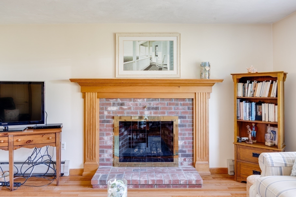 221 Camelback Road Barnstable, MA 02648 - Photo 7 of 31 a living room with fireplace and a fireplace