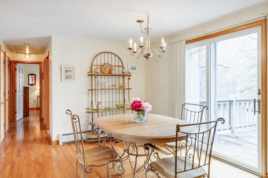 221 Camelback Road Barnstable, MA 02648 - Photo 9 of 31 a view of a dining room with furniture window and wooden floor