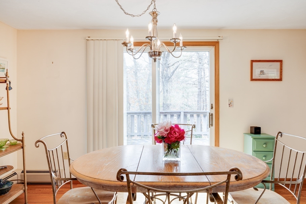 221 Camelback Road Barnstable, MA 02648 - Photo 10 of 31 a view of a dining room with furniture and a chandelier